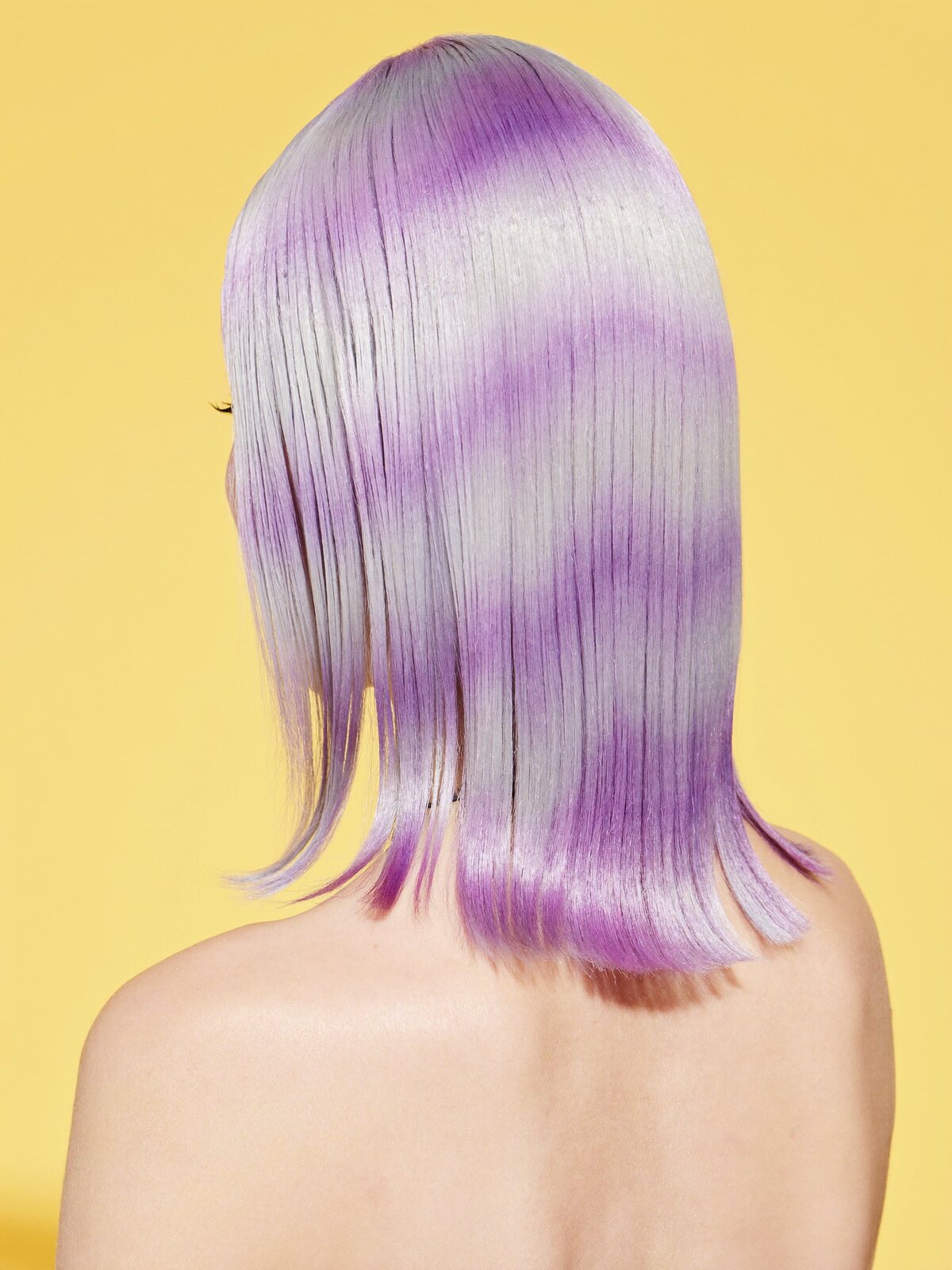 Back view of sleek lilac-to-silver ombre hair