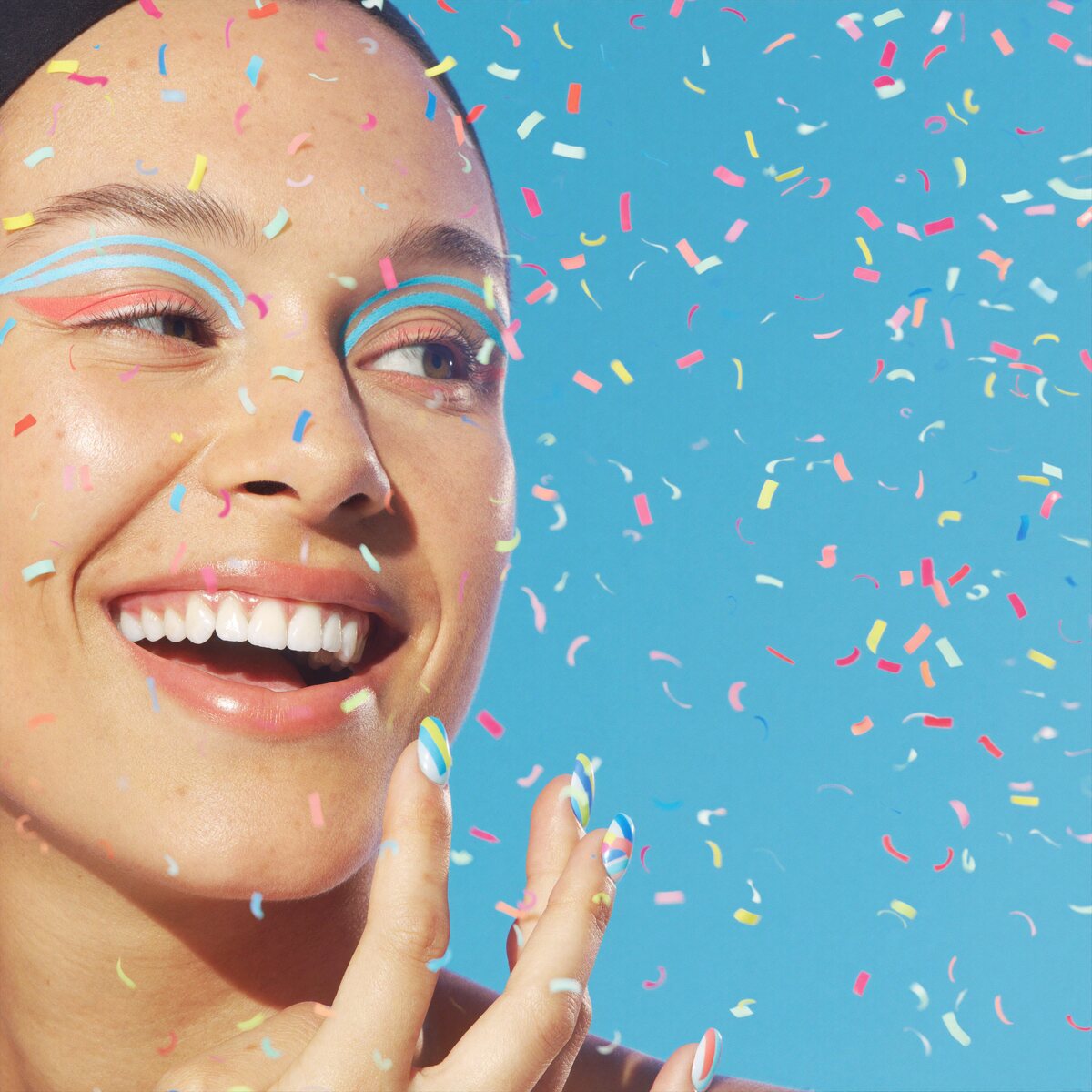 Sky-blue graphic eyeliner with confetti