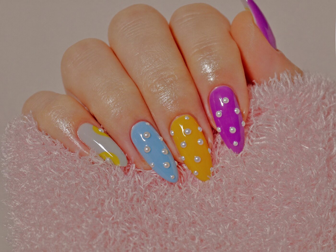Almond nails in different candy colours with pearl details