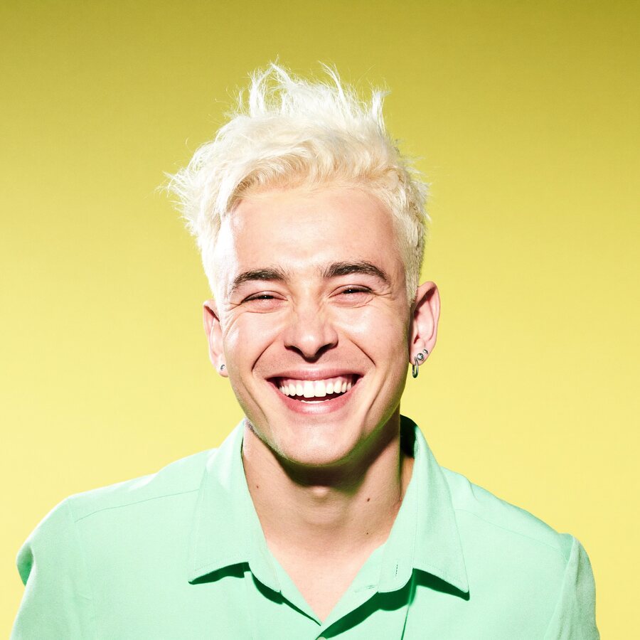 Theo, blond hairstylist in a mint shirt